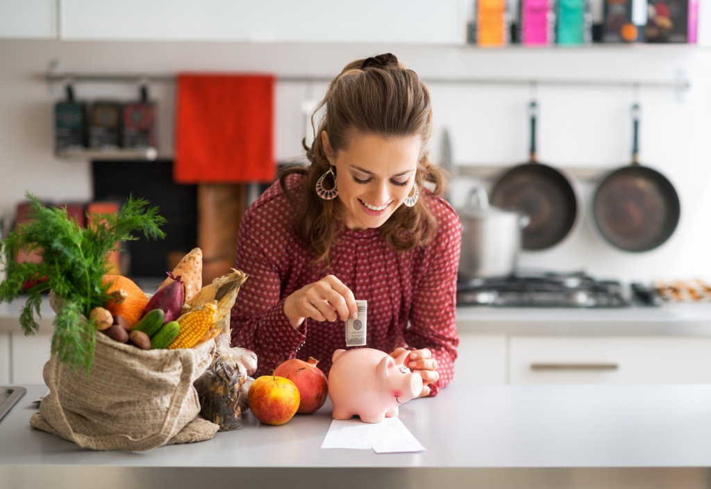 A beautiful woman saving money on food items