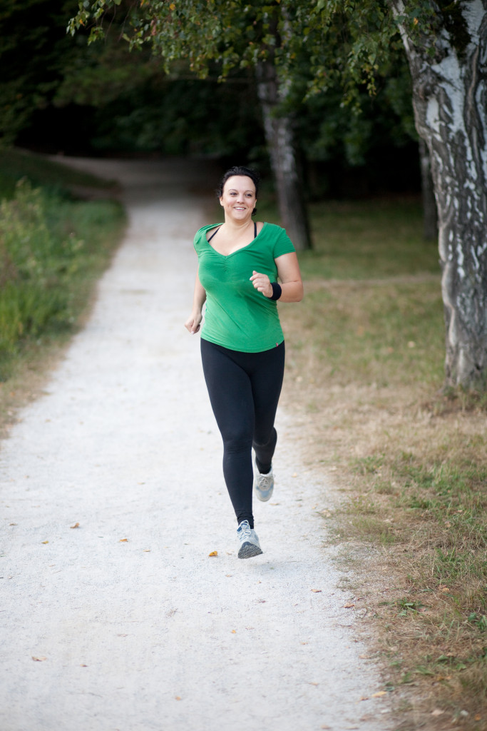 Young obese woman on a morning jog in park