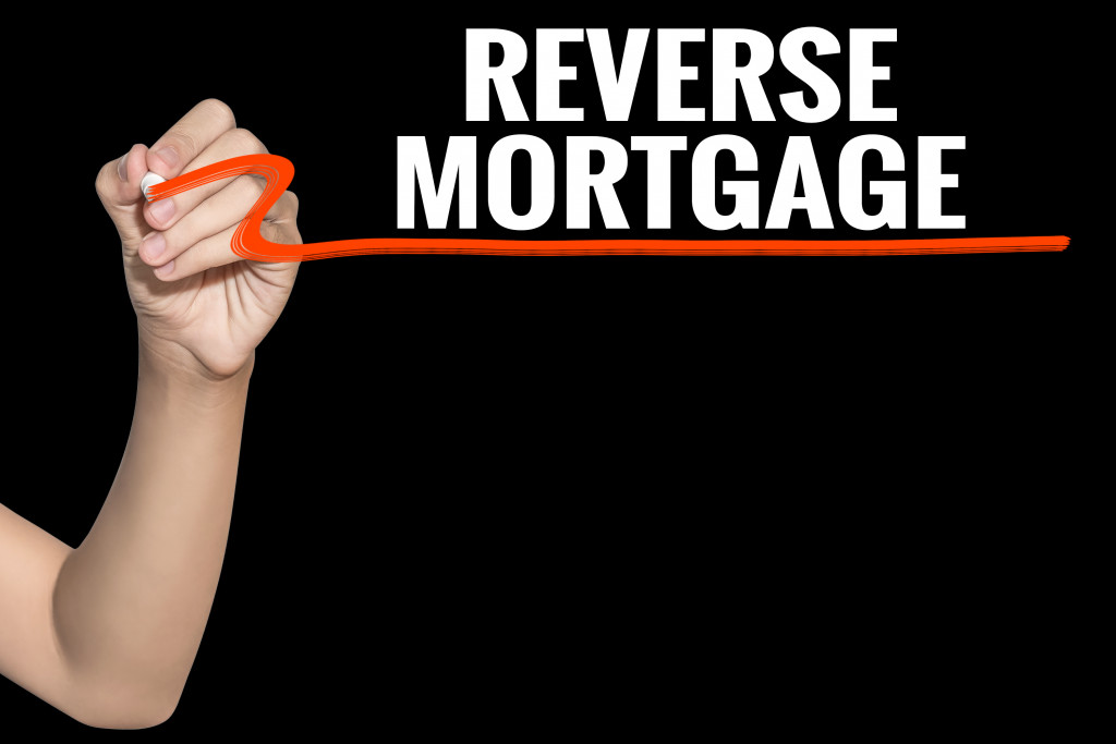 The words reverse mortgage written on a black background