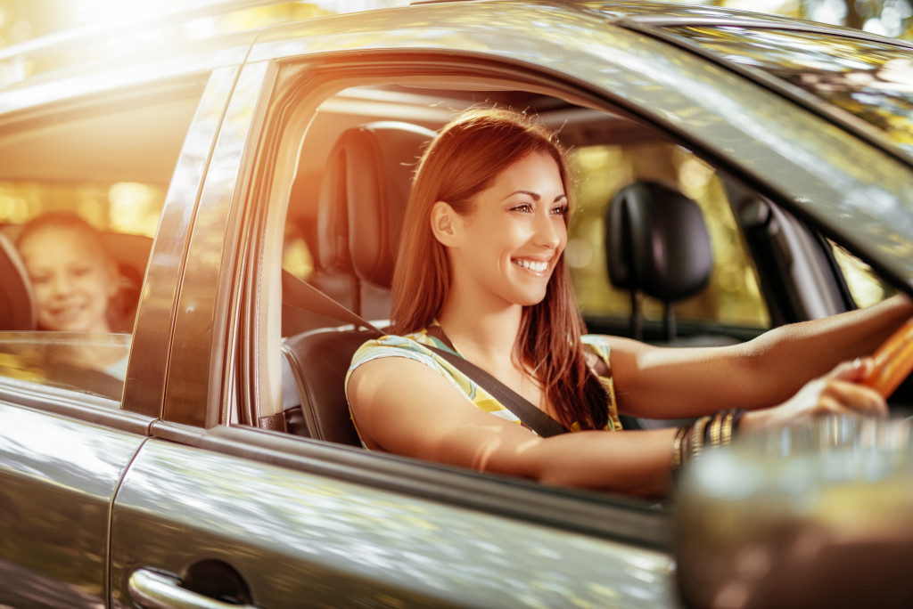 Mother and daughter in a moving car