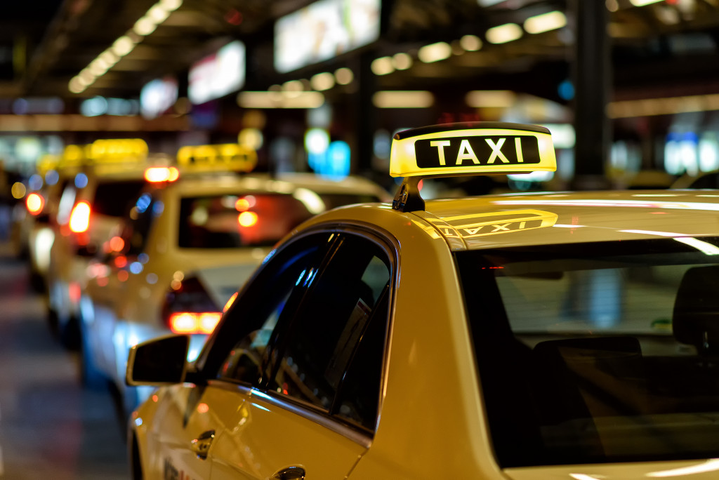 taxi cab in line at station