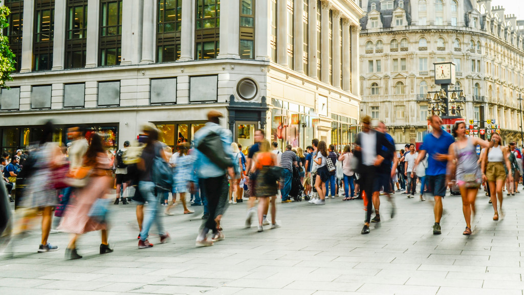 people in the city walking by