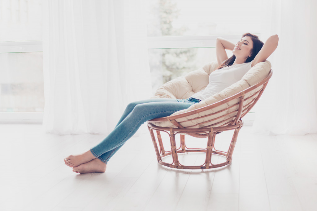 woman sitting and relaxing in her home