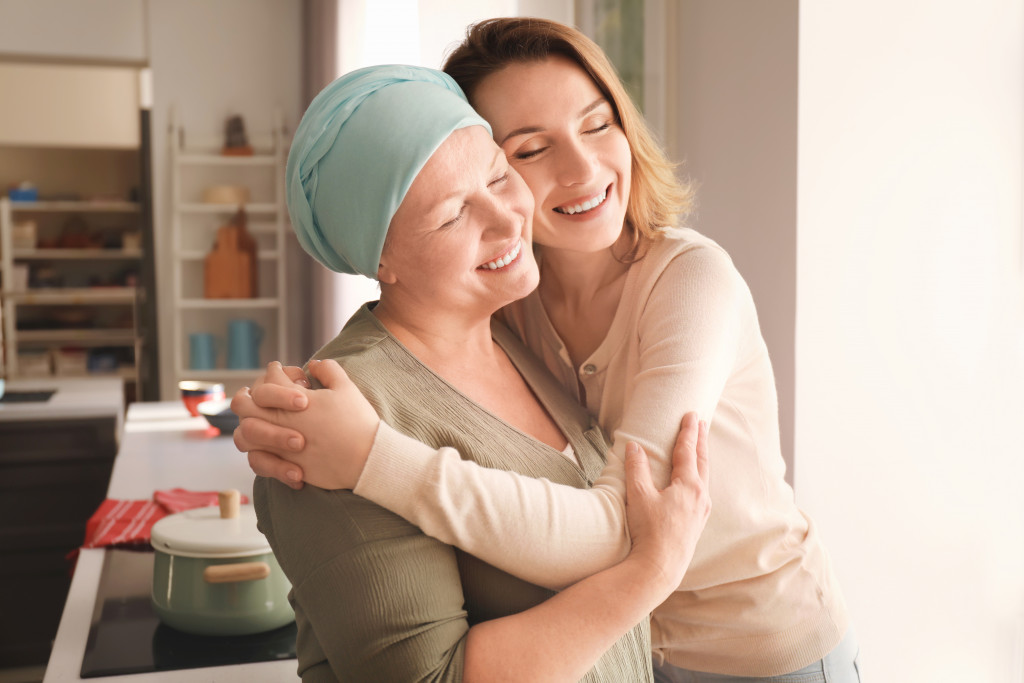 woman hugging mom with cancer