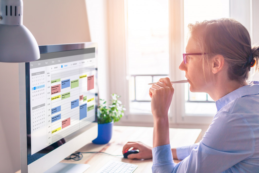 woman working at home creating her monthly schedule