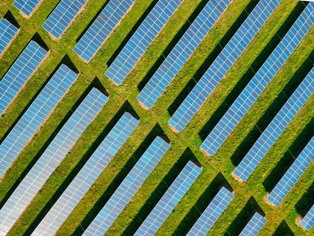 Solar Panels on a Green Field
